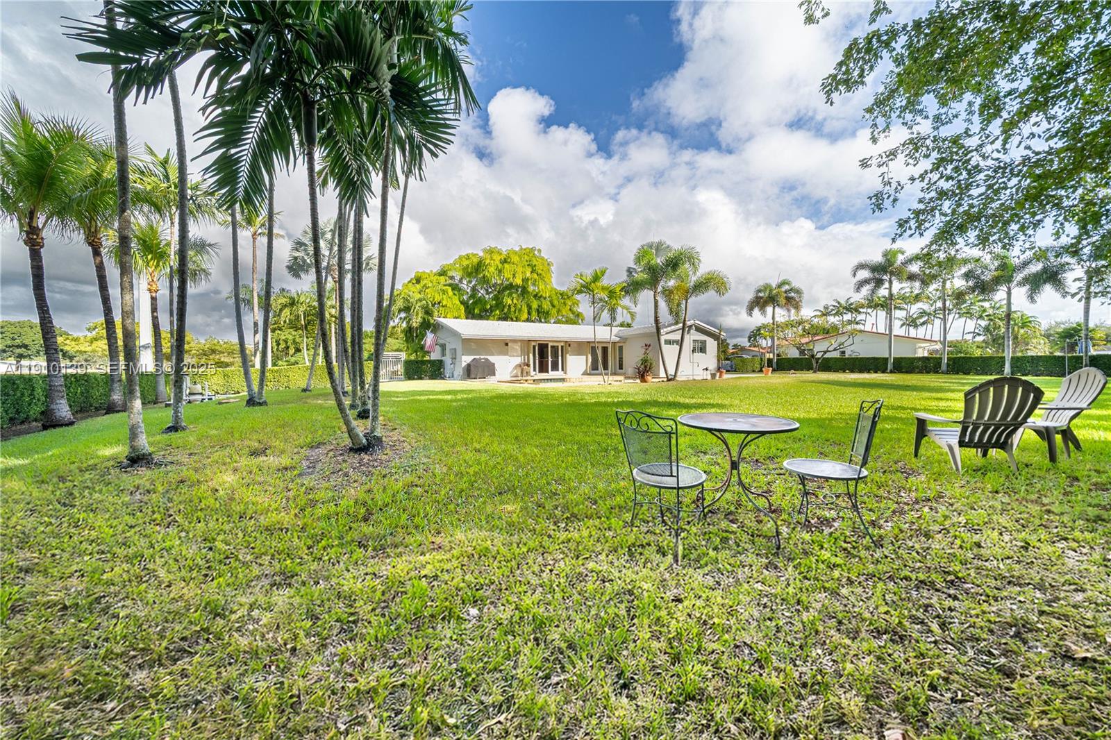10320 Southwest 91st Street Miami, FL 33176 - Photo 26 of 30 a swimming pool with outdoor seating and yard