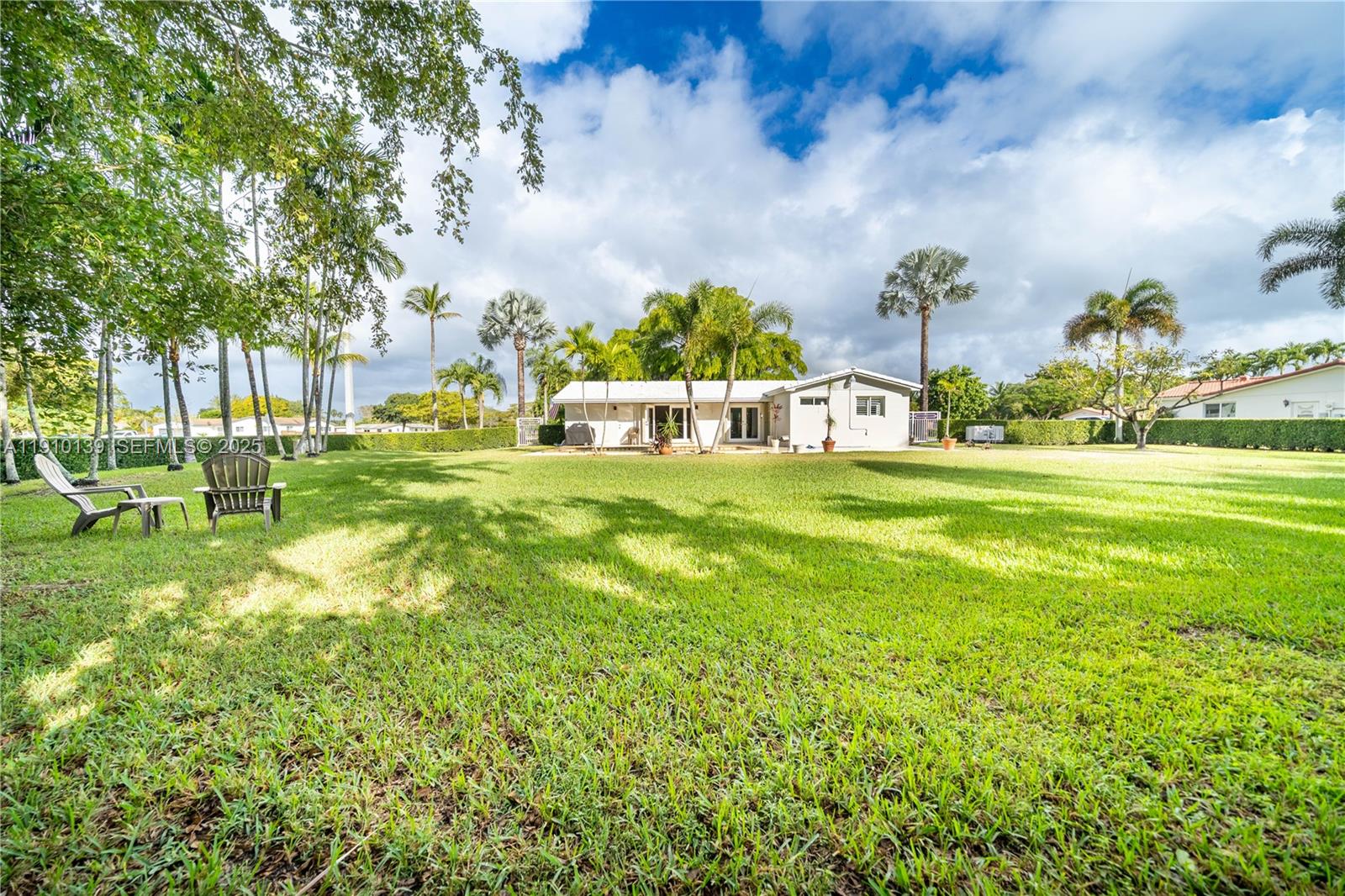 10320 Southwest 91st Street Miami, FL 33176 - Photo 27 of 30 a swimming pool with trees in the background
