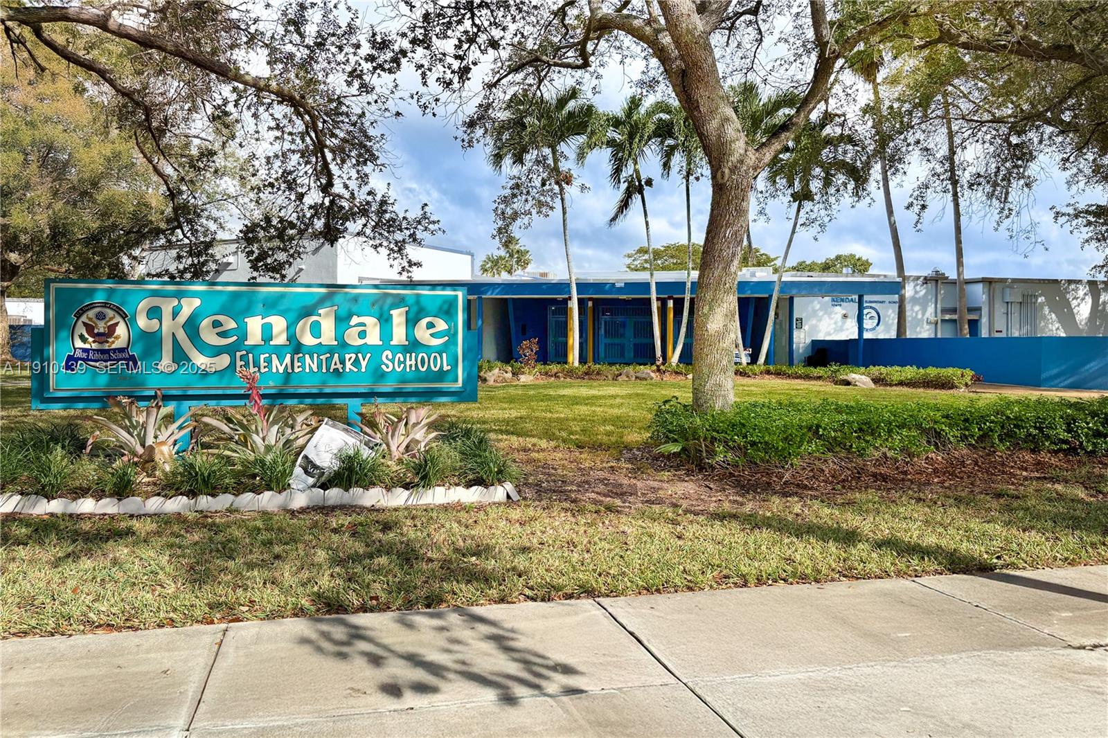 10320 Southwest 91st Street Miami, FL 33176 - Photo 29 of 30 a sign that is sitting on a brick wall