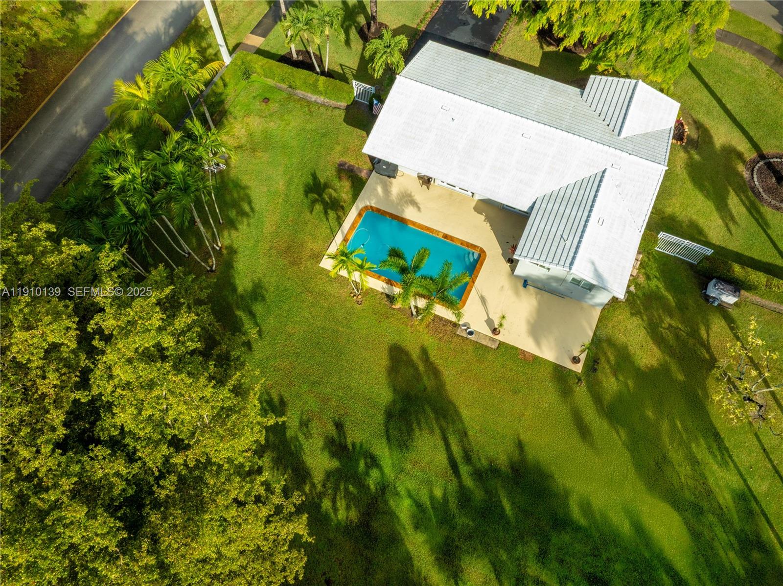 10320 Southwest 91st Street Miami, FL 33176 - Photo 5 of 30 an aerial view of a house with a yard swimming pool and outdoor seating