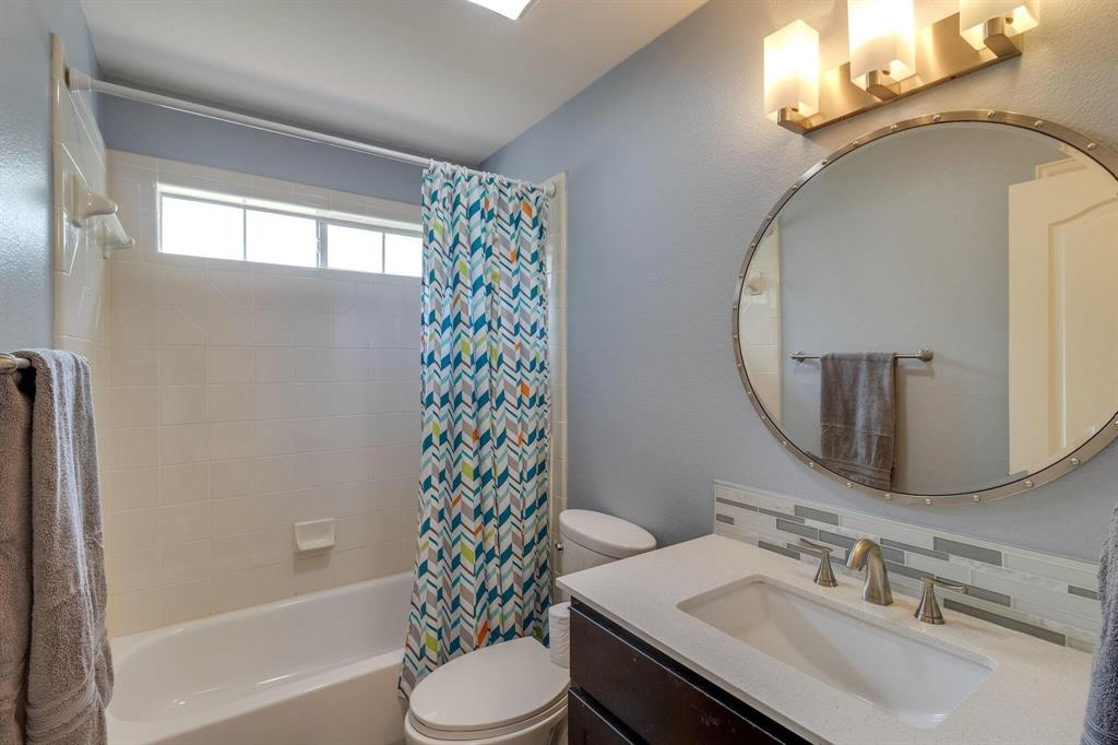18 Greenleaf Drive Trophy Club, TX 76262 - Photo 19 of 25 a bathroom with a sink toilet and shower