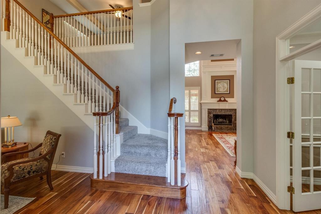 18 Greenleaf Drive Trophy Club, TX 76262 - Photo 7 of 25 a view of entryway and hall with wooden floor