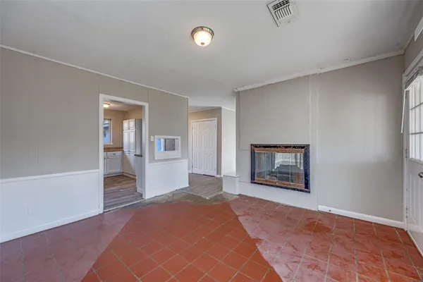 a big room with painting and windows