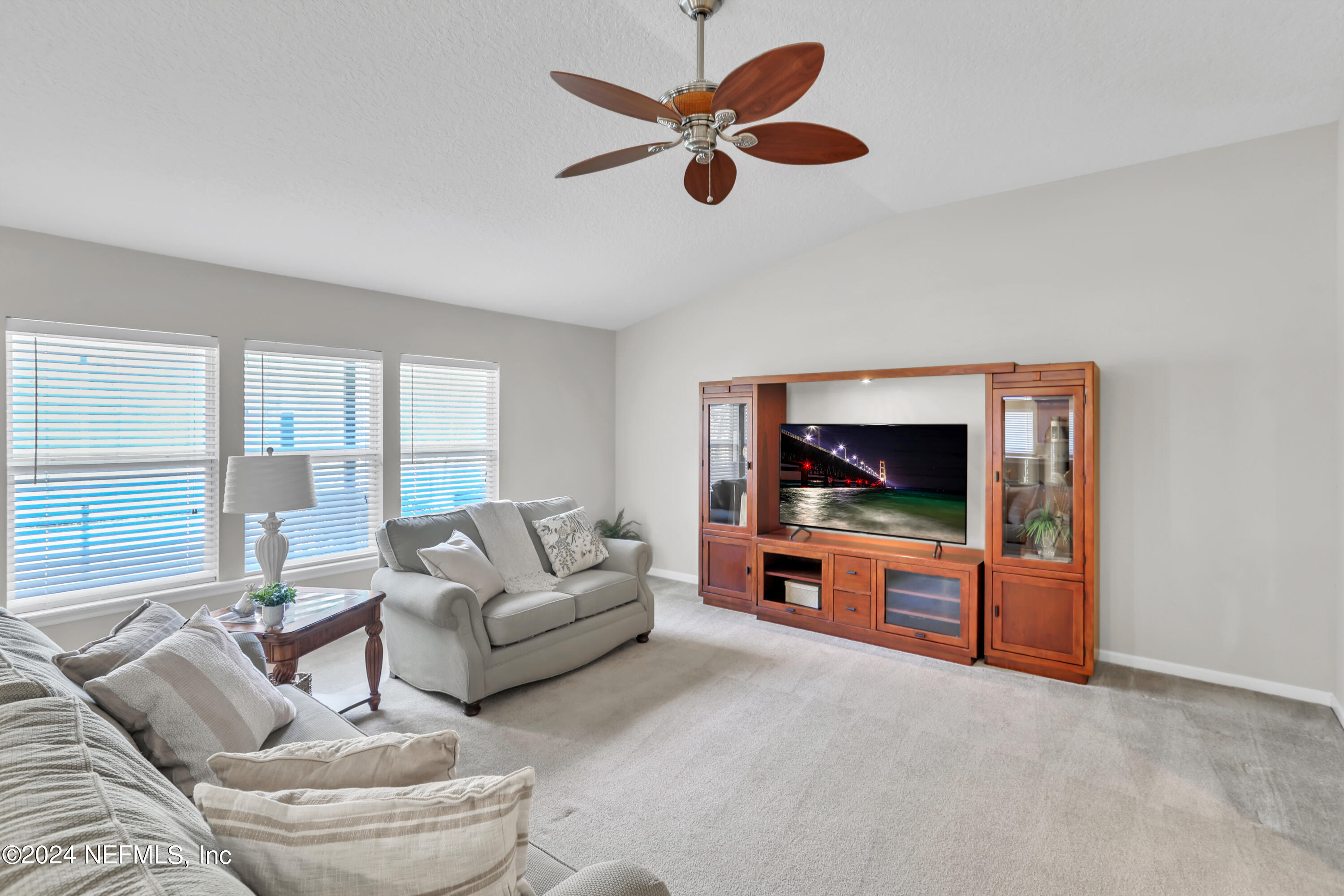 1184 Nochaway Drive St. Augustine, FL 32092 - Photo 15 of 39 a living room with furniture and a flat screen tv