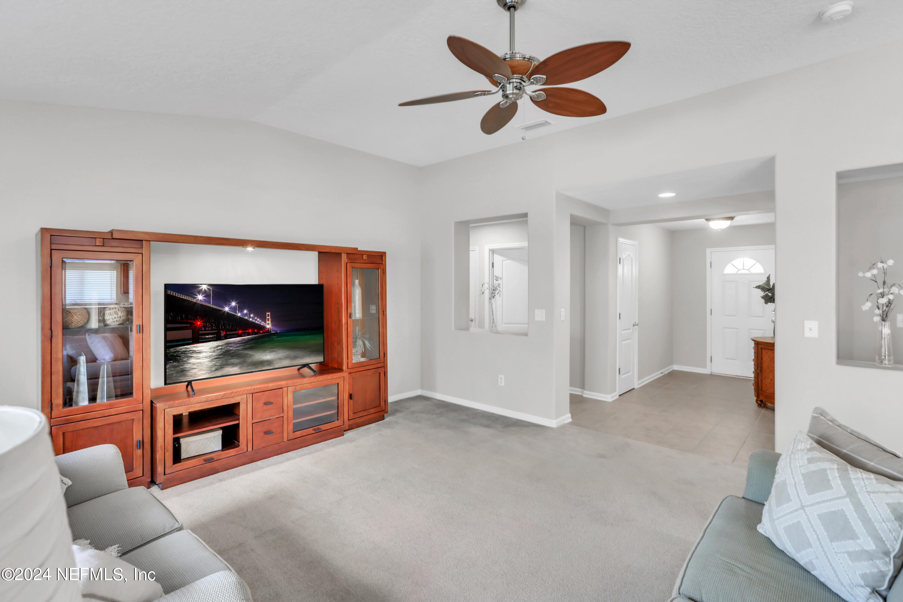 1184 Nochaway Drive St. Augustine, FL 32092 - Photo 16 of 39 a living room with furniture and a flat screen tv