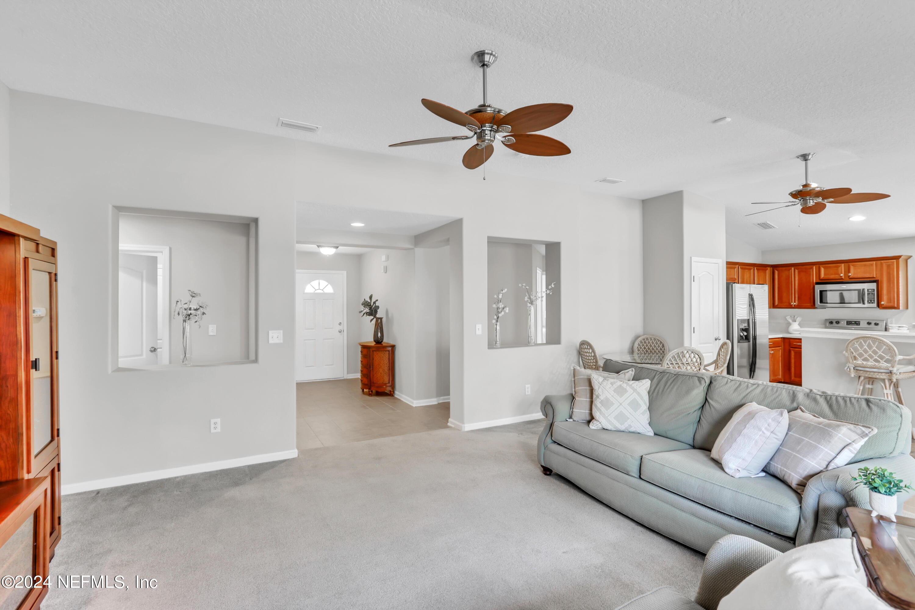 1184 Nochaway Drive St. Augustine, FL 32092 - Photo 17 of 39 a living room with furniture and a chandelier