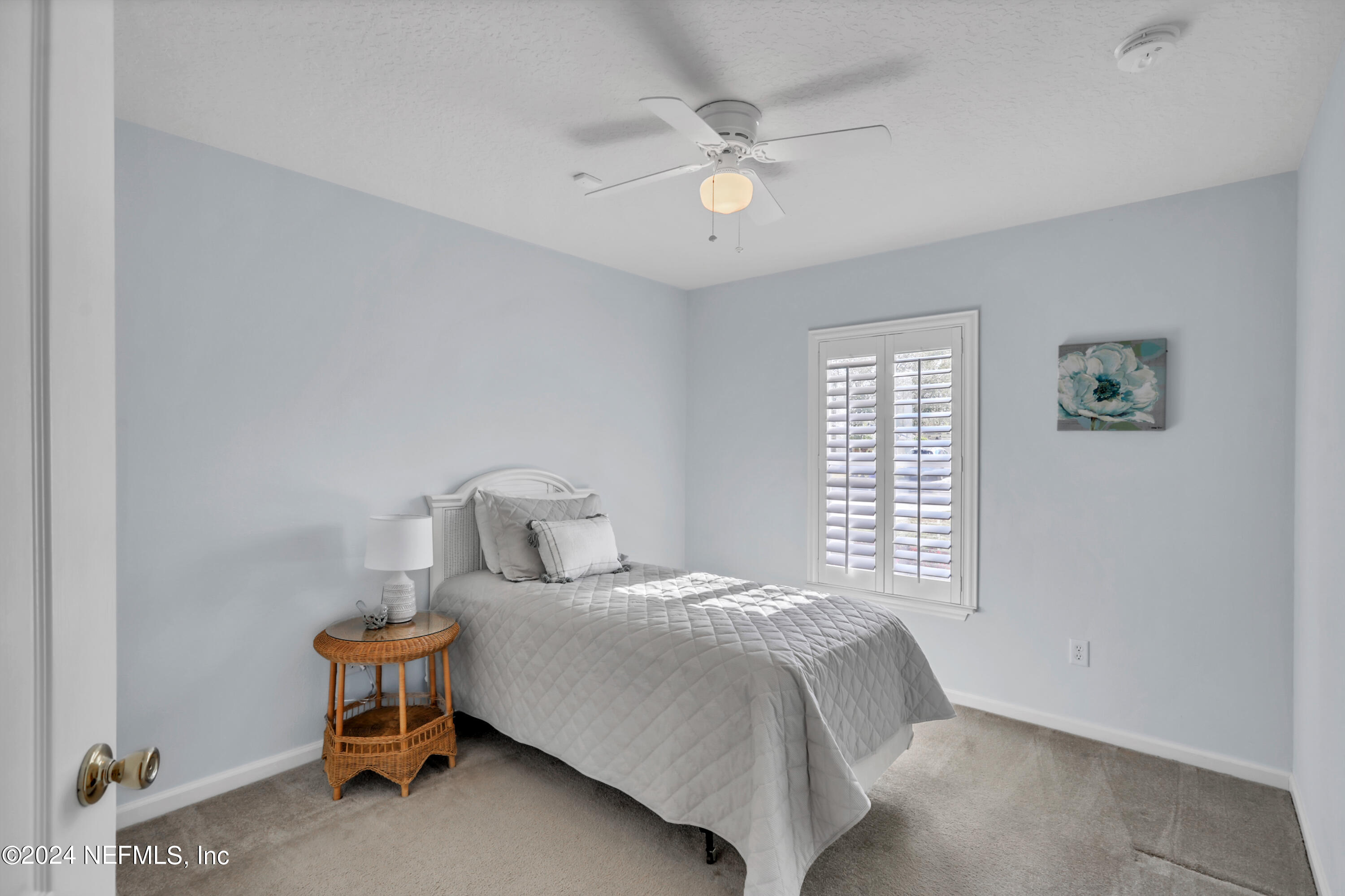 1184 Nochaway Drive St. Augustine, FL 32092 - Photo 21 of 39 a bedroom with a bed and a window