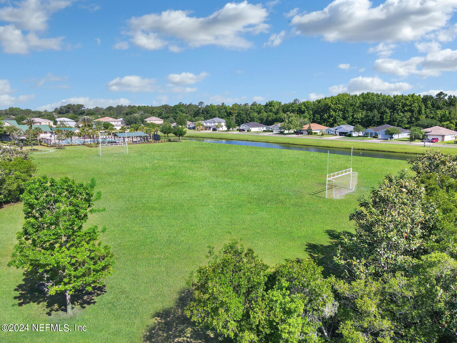 1184 Nochaway Drive St. Augustine, FL 32092 - Photo 28 of 39 a view of a lake with houses in the background