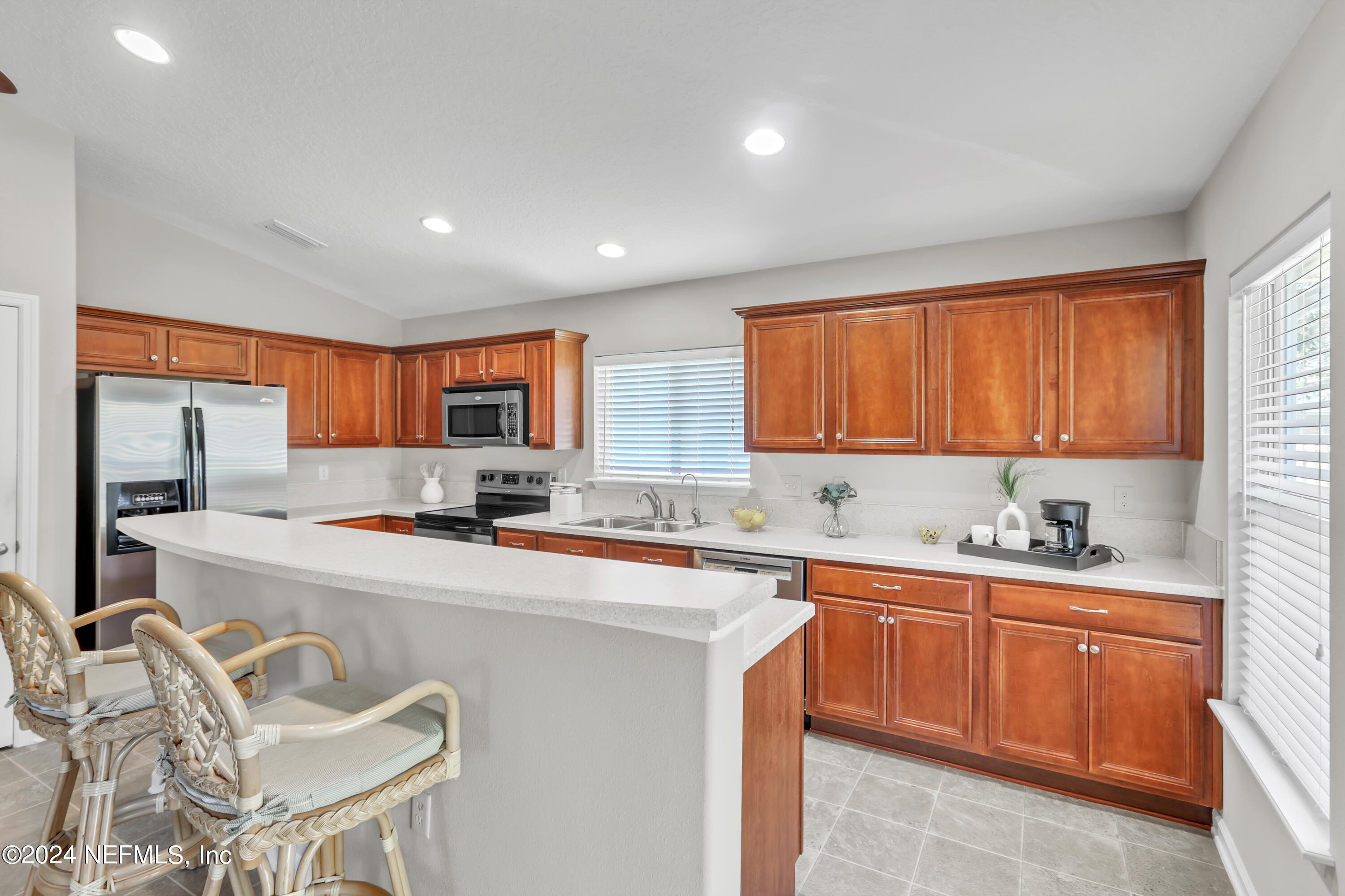 1184 Nochaway Drive St. Augustine, FL 32092 - Photo 4 of 39 a kitchen with a sink a window and cabinets