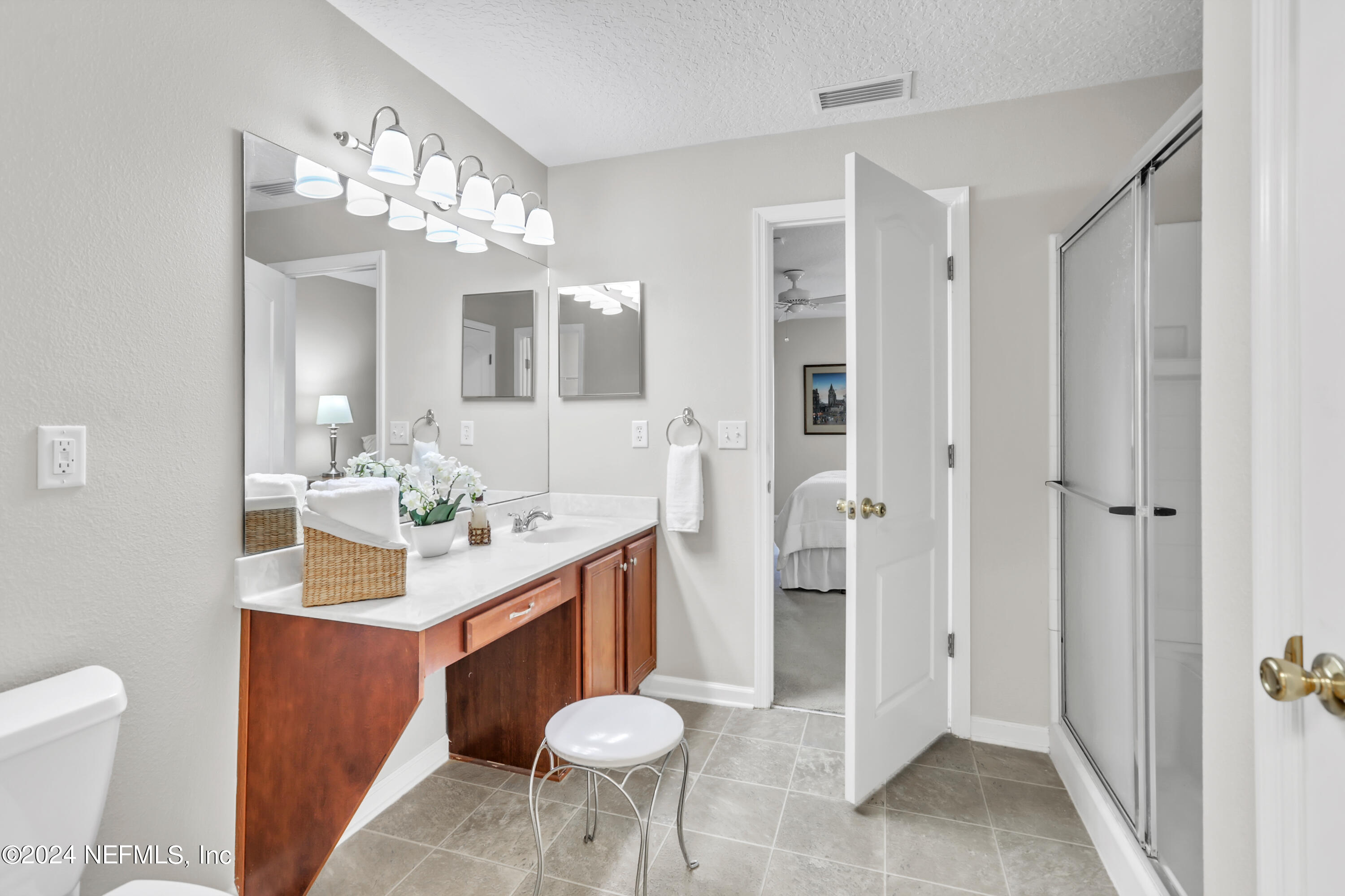 1184 Nochaway Drive St. Augustine, FL 32092 - Photo 7 of 39 a bathroom with a sink vanity and a mirror