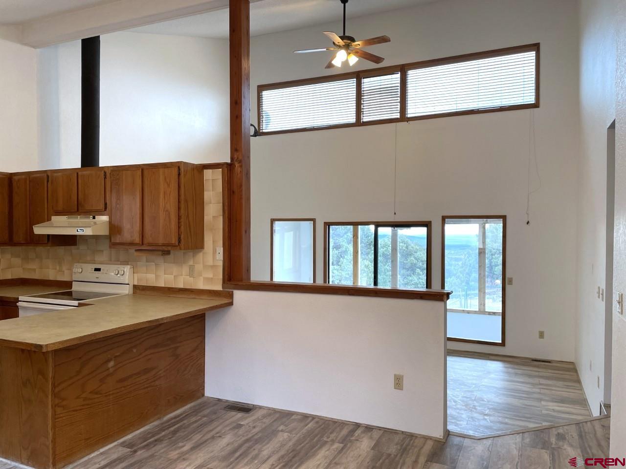 21566 Uintah Road Cedaredge, CO 81413 - Photo 11 of 33 a kitchen with a sink cabinets and wooden floor