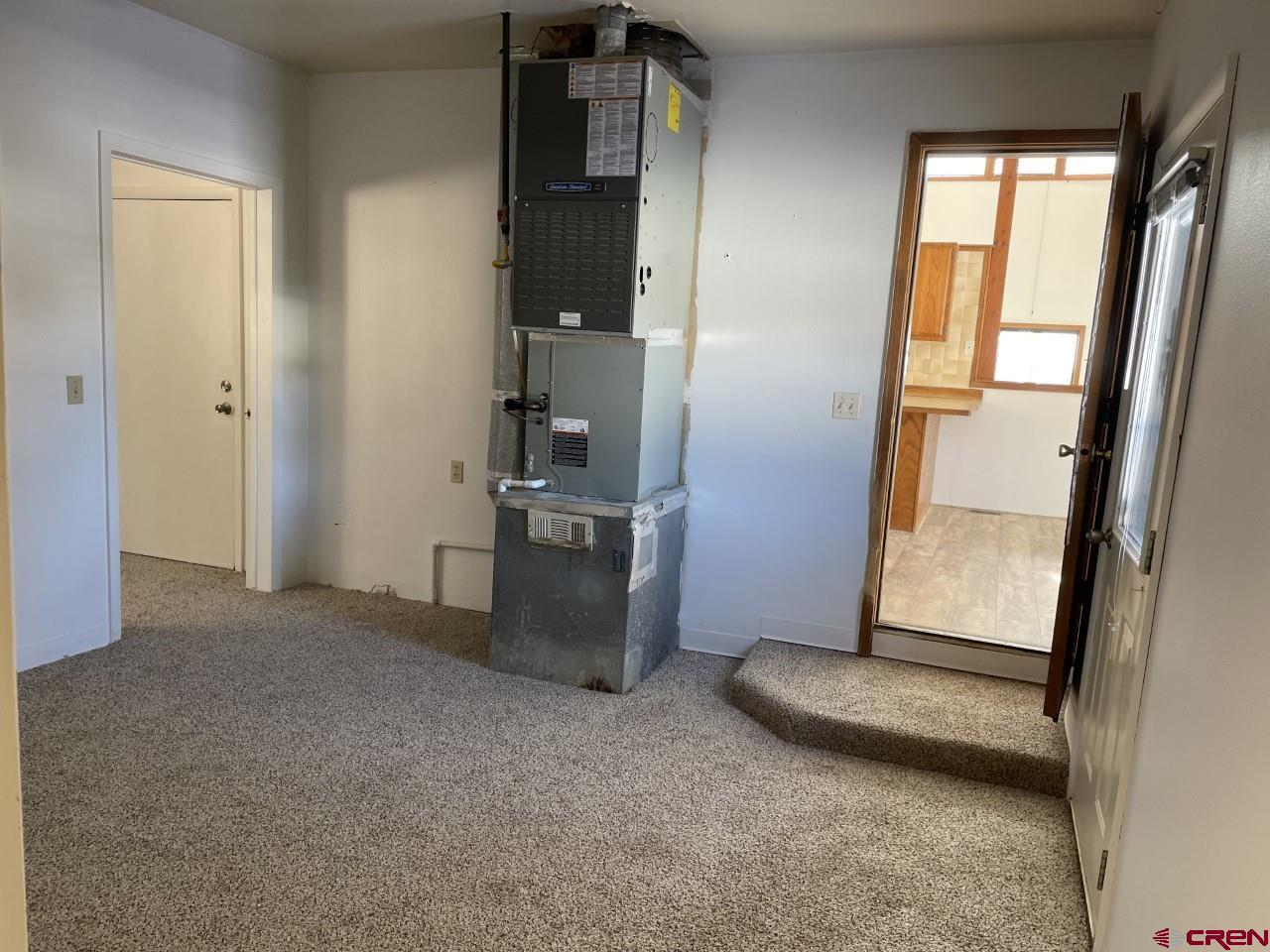 21566 Uintah Road Cedaredge, CO 81413 - Photo 22 of 33 an empty room with windows