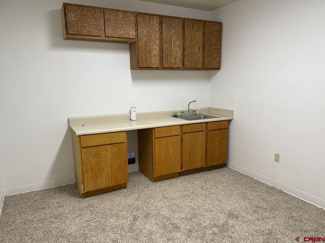 21566 Uintah Road Cedaredge, CO 81413 - Photo 24 of 33 a utility room with sink dryer and washer