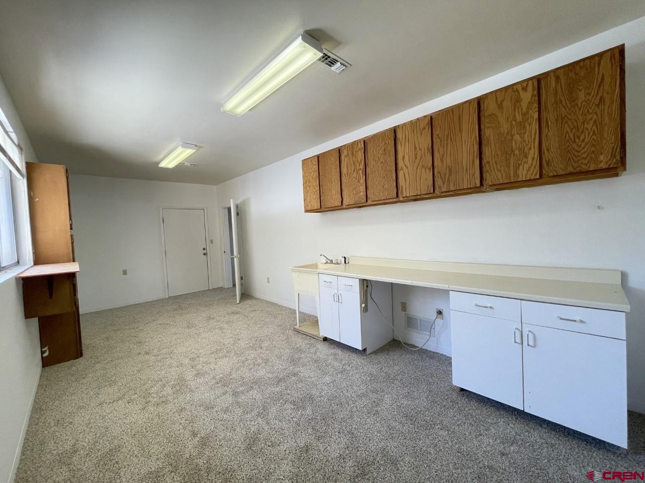 21566 Uintah Road Cedaredge, CO 81413 - Photo 26 of 33 a view of a kitchen with cabinets