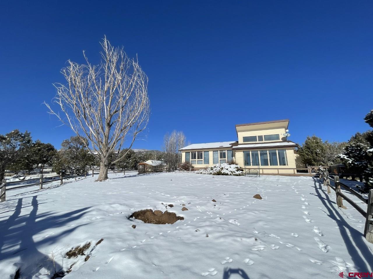 21566 Uintah Road Cedaredge, CO 81413 - Photo 27 of 33 a view of a house with a yard