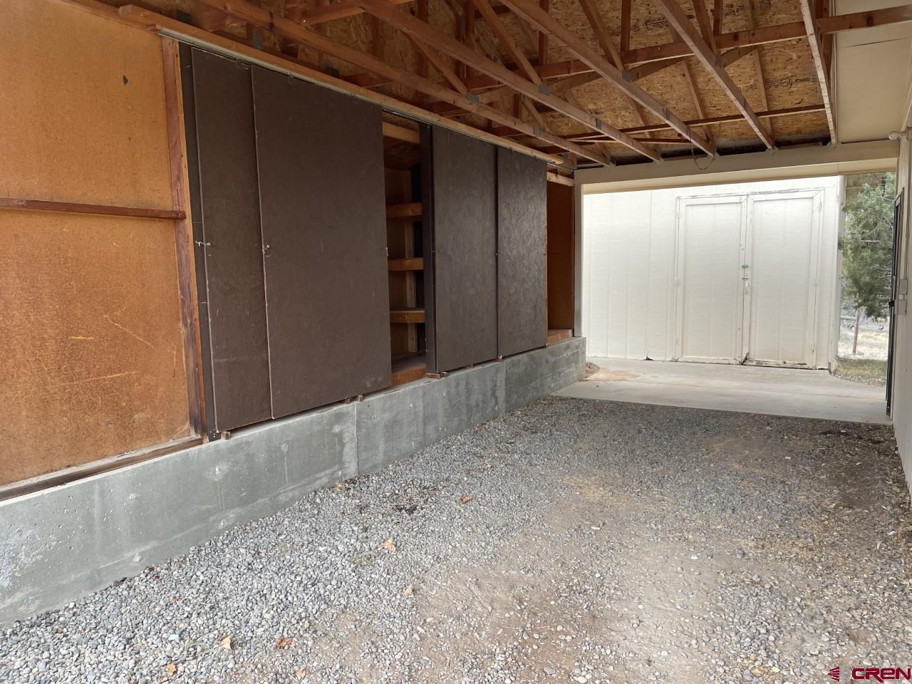 21566 Uintah Road Cedaredge, CO 81413 - Photo 33 of 33 a view of a room with wooden walls
