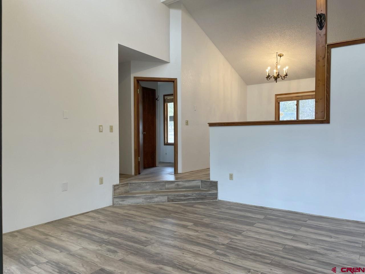 21566 Uintah Road Cedaredge, CO 81413 - Photo 10 of 33 a view of empty room with wooden floor and fan