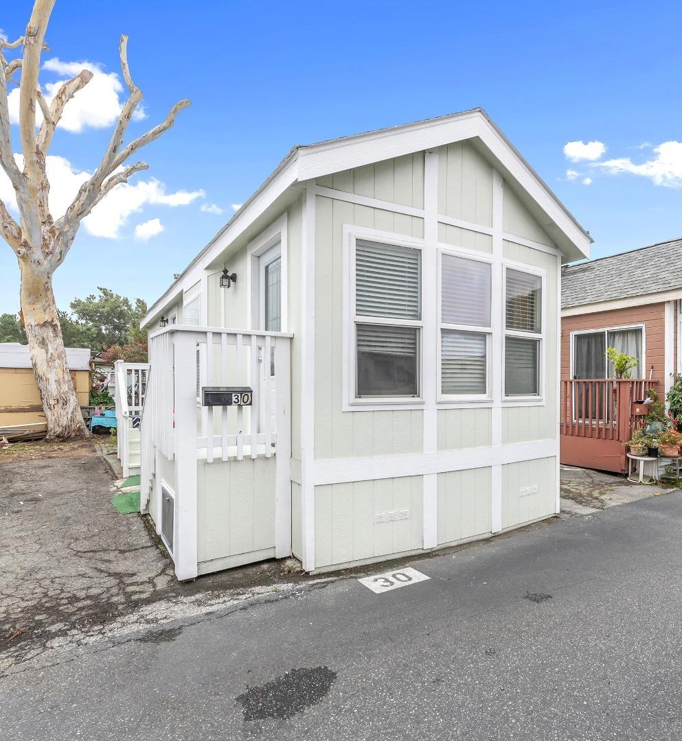 3499 East Bayshore Road, Unit 30 Redwood City, CA 94063 - Photo 1 of 1 a view of a house with a yard
