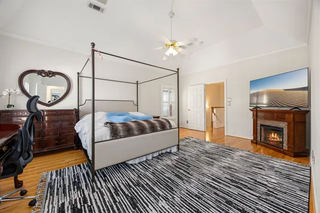 a living room with a bed and a fireplace