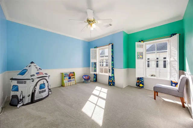 a bedroom with furniture and a chandelier
