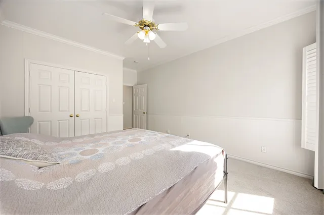 a large white bed in a white room