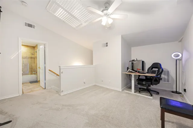 a view of a workspace with furniture