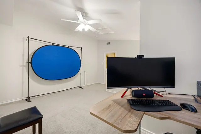 a room with a couch and a flat screen tv