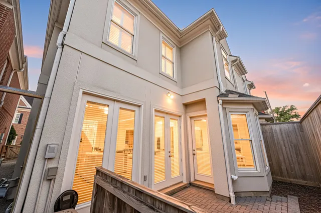 a view of a house with a small yard