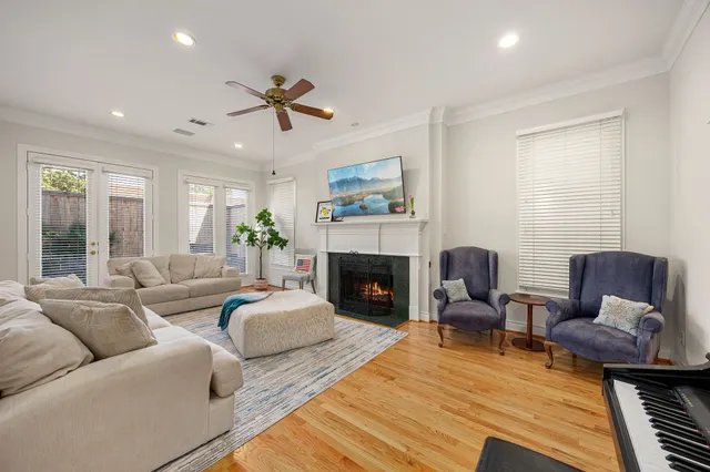 a living room with furniture fireplace and window