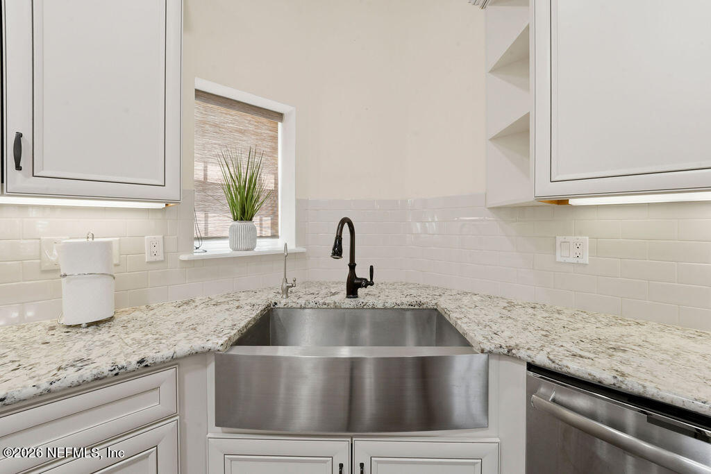 48 Ocale Court St. Augustine, FL 32084 - Photo 12 of 59 a kitchen with granite countertop a sink and a window