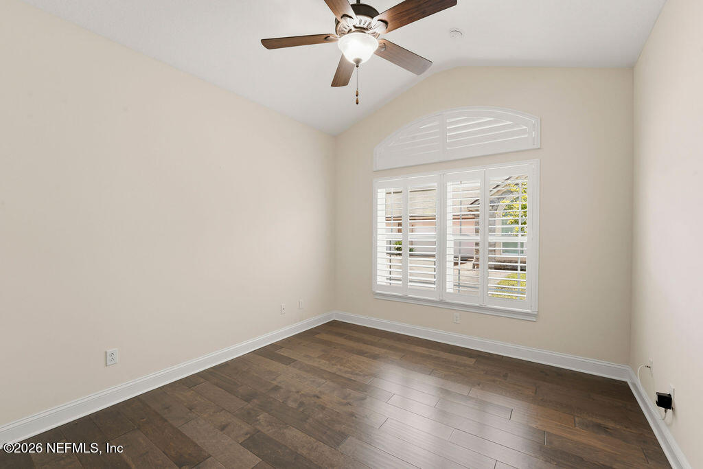 48 Ocale Court St. Augustine, FL 32084 - Photo 32 of 59 an empty room with wooden floor chandelier fan and windows
