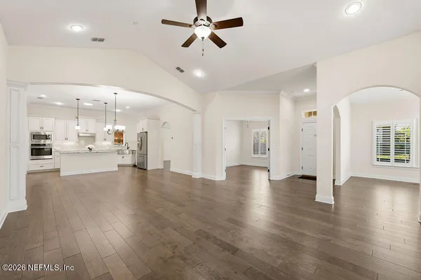 a kitchen with stainless steel appliances granite countertop a refrigerator and a sink