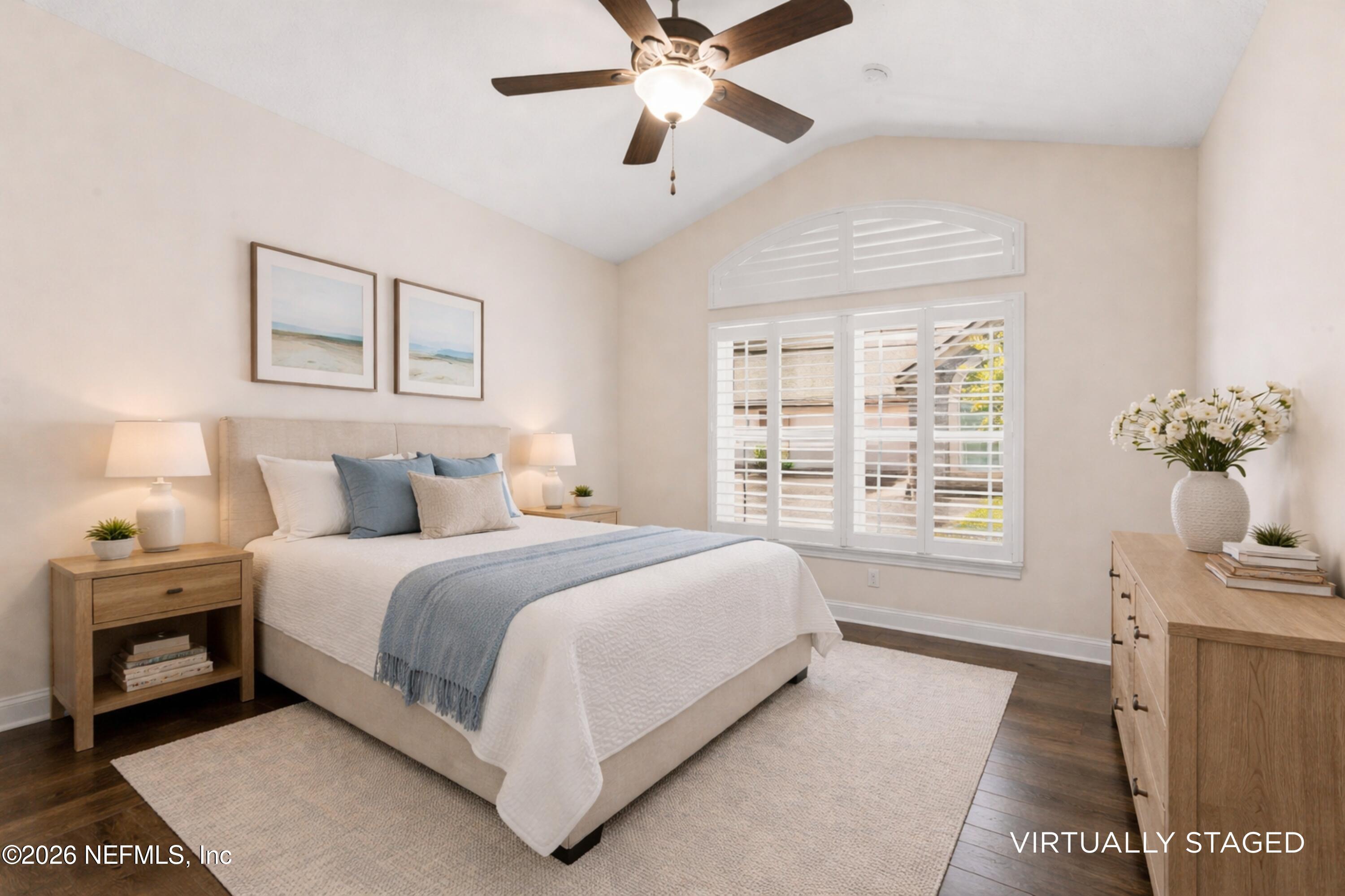 48 Ocale Court St. Augustine, FL 32084 - Photo 59 of 59 a spacious bedroom with a bed and a chandelier