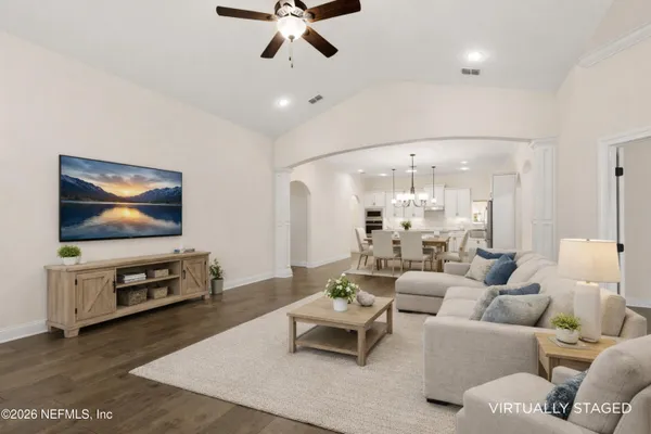 a living room with furniture and a table
