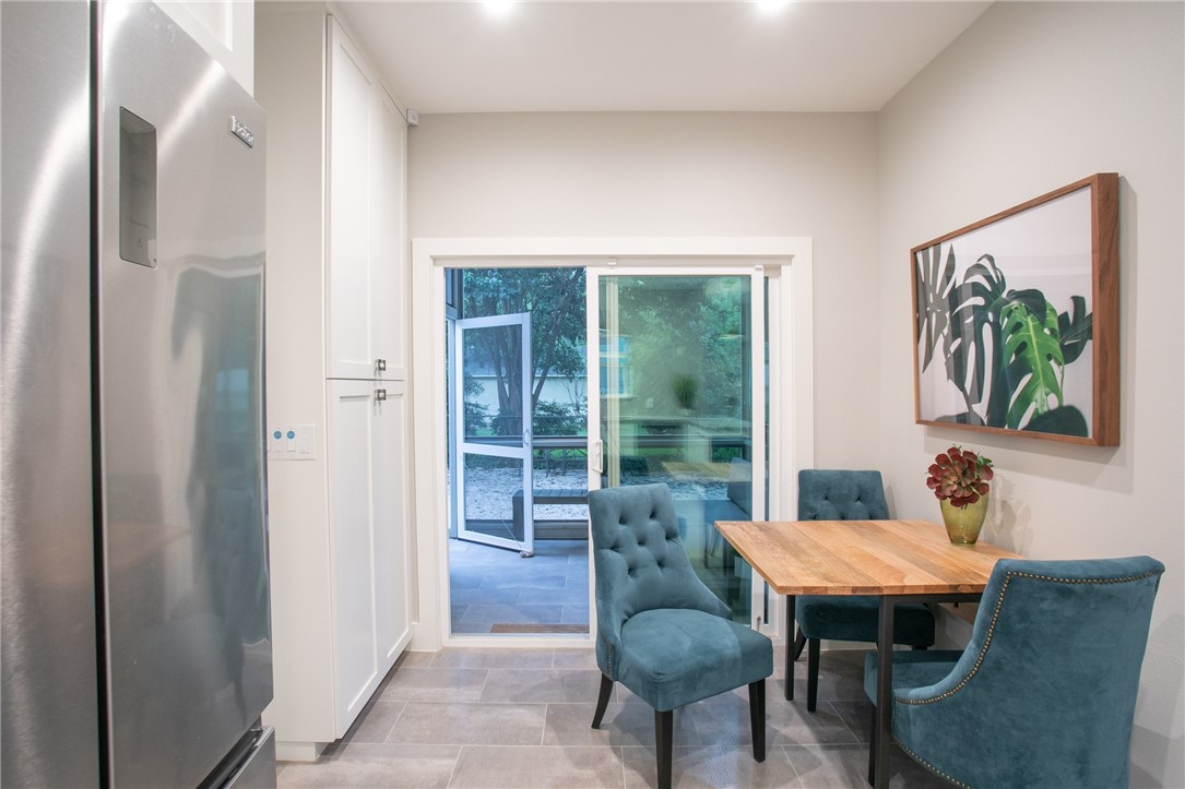 6613 Woodrow Avenue Austin, TX 78757 - Photo 12 of 27 a view of a dining room with furniture window and outside view