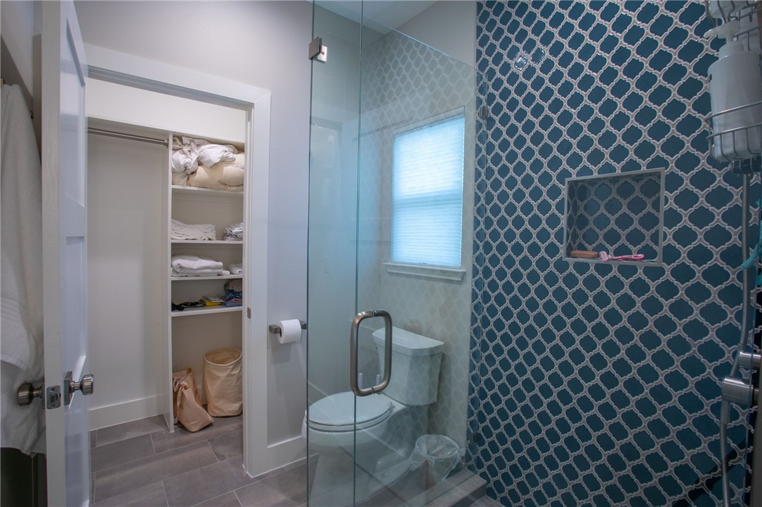 6613 Woodrow Avenue Austin, TX 78757 - Photo 20 of 27 a bathroom with a toilet and a shower