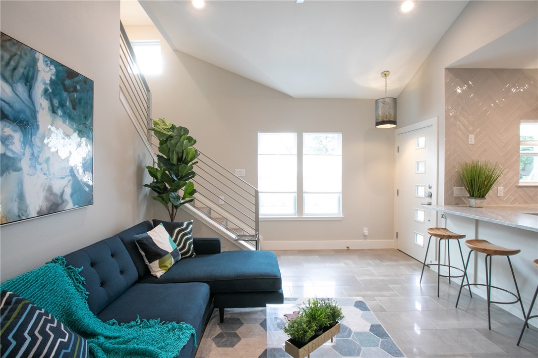 6613 Woodrow Avenue Austin, TX 78757 - Photo 6 of 27 a living room with furniture and a large window