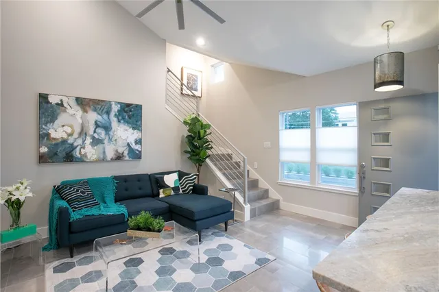 a living room with furniture and a rug