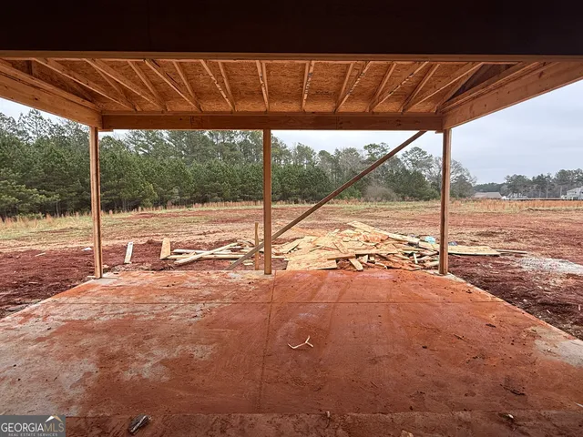 a view of a room with a door and stairs