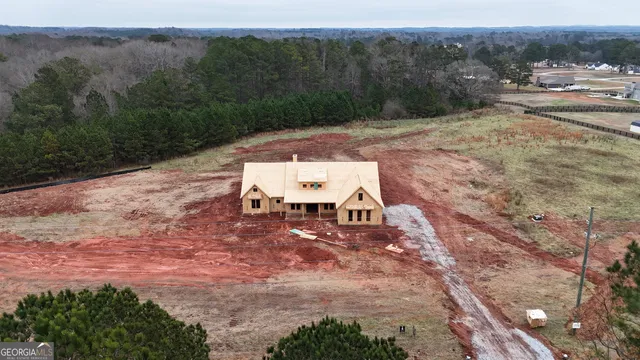 an aerial view of a house with mountain view