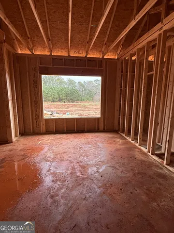 a view of a room with wooden walls