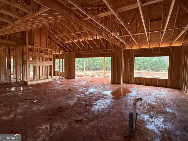 a view of a backyard with wooden fence