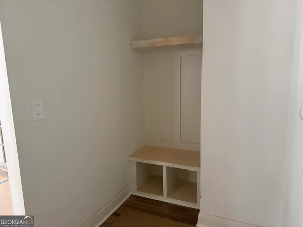 a room with window and a ceiling fan