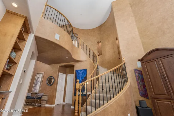 a view of a livingroom with furniture and hardwood floor
