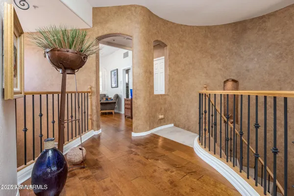 a bed room with a bed and a chandelier