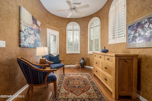 a balcony with table and chairs