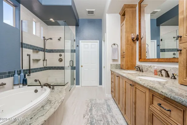 a bathroom with a tub and a shower