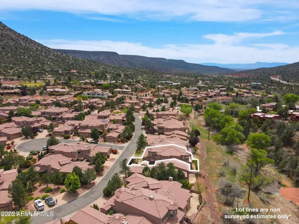 an aerial view of a house with outdoor space
