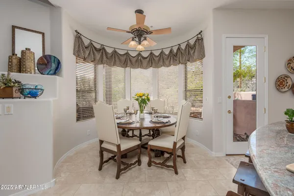 a kitchen with granite countertop a sink stainless steel appliances and cabinets