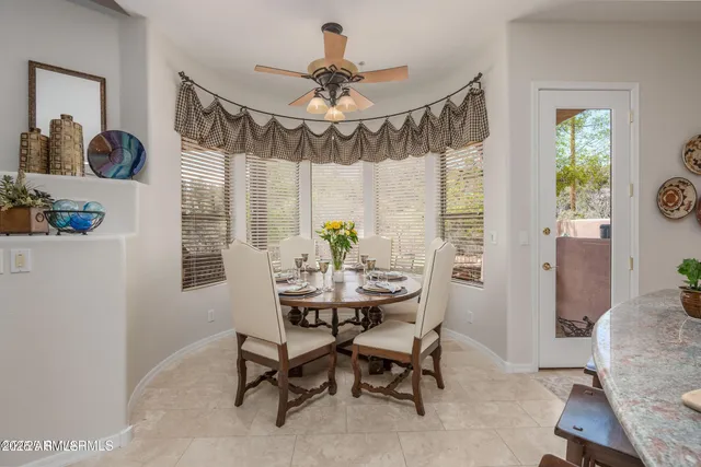 a kitchen with granite countertop a sink stainless steel appliances and cabinets